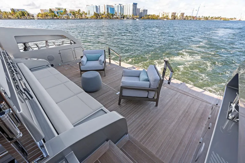 Tenacious Yacht Photos Pics Luxurious deck of 2025 Riva 130' Bellissima yacht with elegant seating and ocean view.