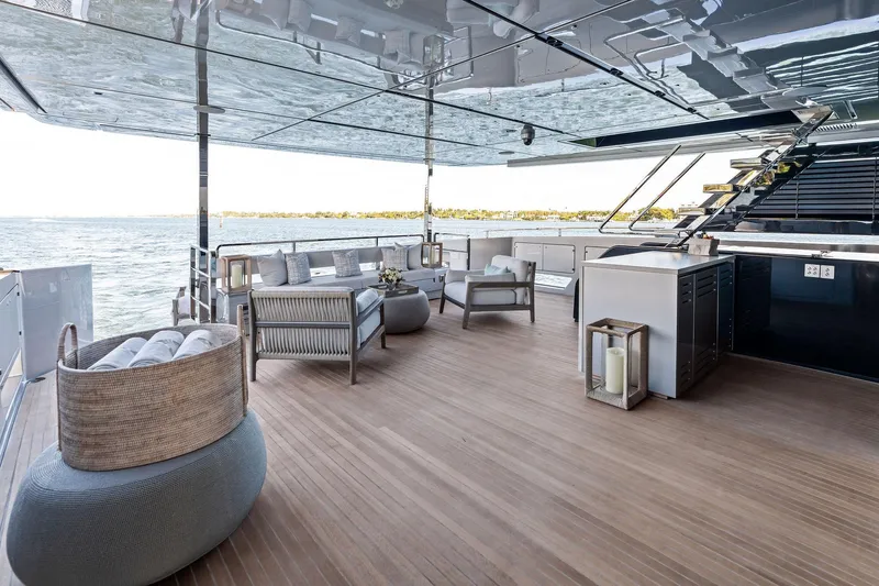 Tenacious Yacht Photos Pics Luxurious deck of 2025 Riva 130' Bellissima yacht with elegant seating and ocean view.