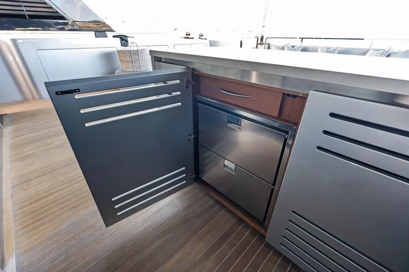 Tenacious Yacht Photos Pics Open cabinet on Riva 130' Bellissima yacht, showcasing sleek stainless steel drawers, 2025 model.