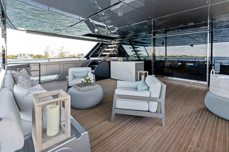 Tenacious Yacht Photos Pics Luxurious deck of 2025 Riva 130' Bellissima yacht with elegant seating and ocean view.