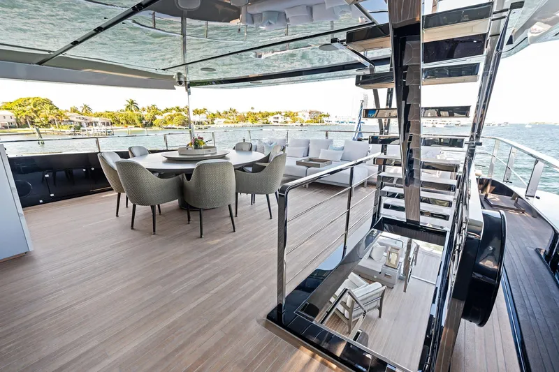 Tenacious Yacht Photos Pics Luxurious deck of 2025 Riva 130' Bellissima yacht with elegant seating and ocean view.