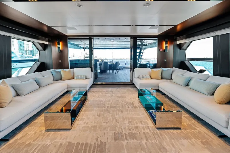 Tenacious Yacht Photos Pics Luxurious interior of 2025 Riva 130' Bellissima yacht with elegant seating and modern decor.