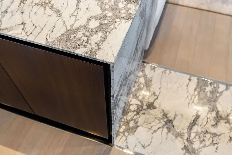 Tenacious Yacht Photos Pics Luxurious marble and wood interior detail on 2025 Riva 130' Bellissima yacht.