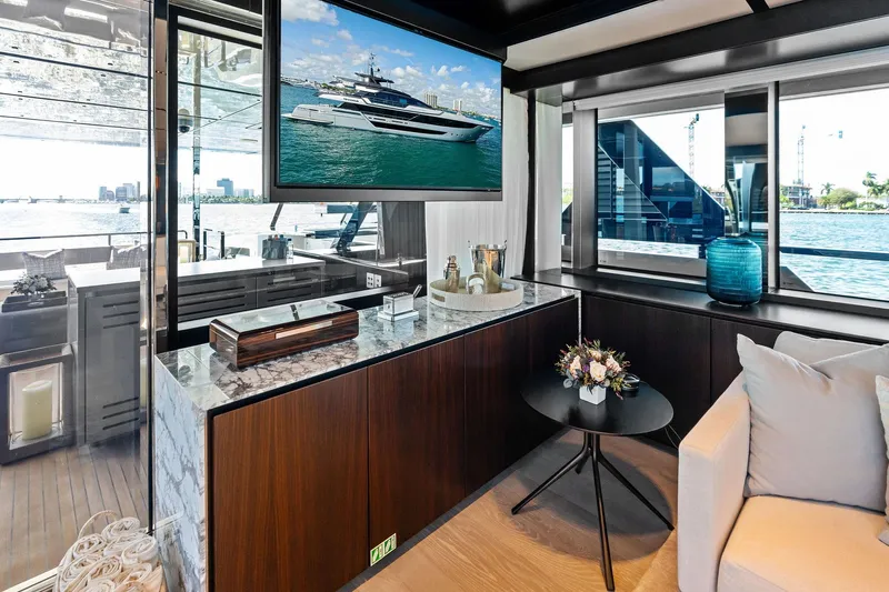 Tenacious Yacht Photos Pics Luxurious interior of 2025 Riva 130' Bellissima yacht with elegant decor and waterfront view.