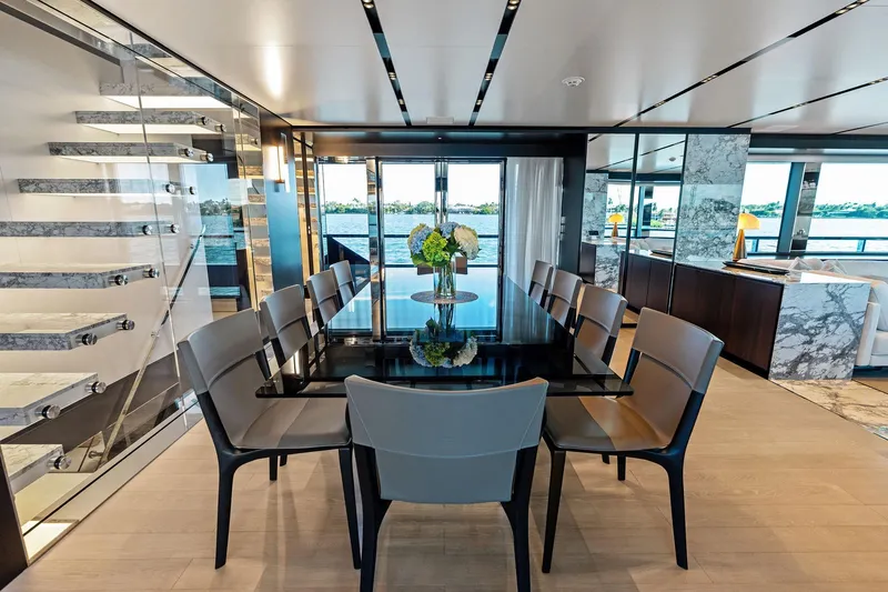 Tenacious Yacht Photos Pics Luxurious dining area on 2025 Riva 130' Bellissima yacht with elegant decor and scenic views.