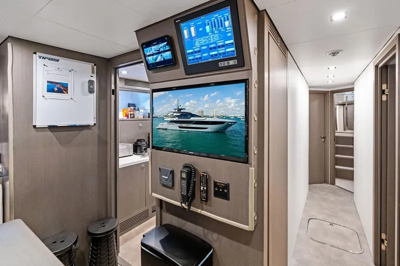 Tenacious Yacht Photos Pics Interior of 2025 Riva 130' Bellissima yacht with modern control panels and sleek design.