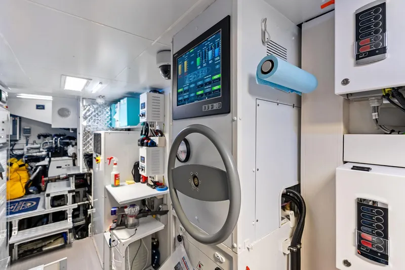 Tenacious Yacht Photos Pics Engine room of 2025 Riva 130' Bellissima yacht with control panel and equipment.