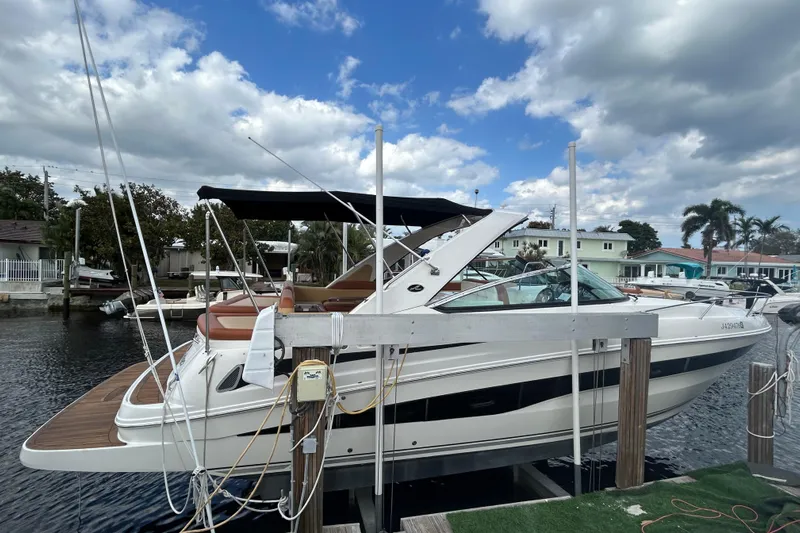 Mr Bojangles Yacht Photos Pics 2014 Sea Ray 370 Venture docked under a partly cloudy sky.