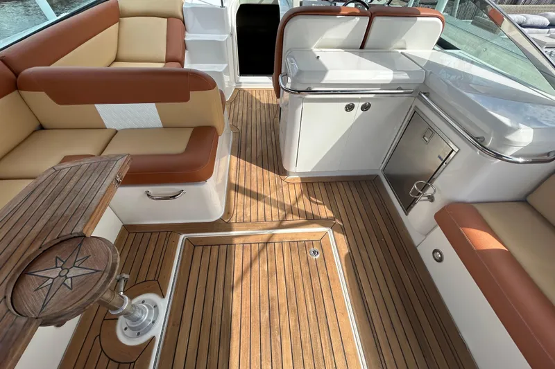 Mr Bojangles Yacht Photos Pics Luxurious 2014 Sea Ray 370 Venture boat interior with teak flooring and plush seating.