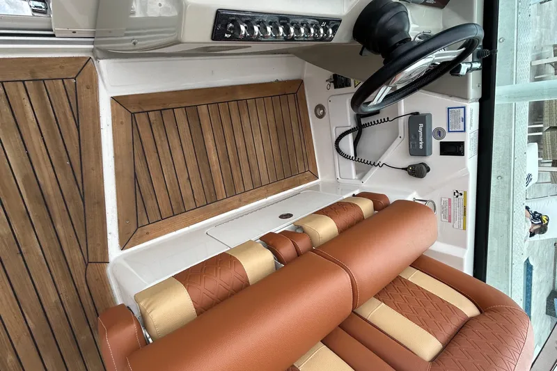 Mr Bojangles Yacht Photos Pics 2014 Sea Ray 370 Venture helm with wood accents and leather seating.