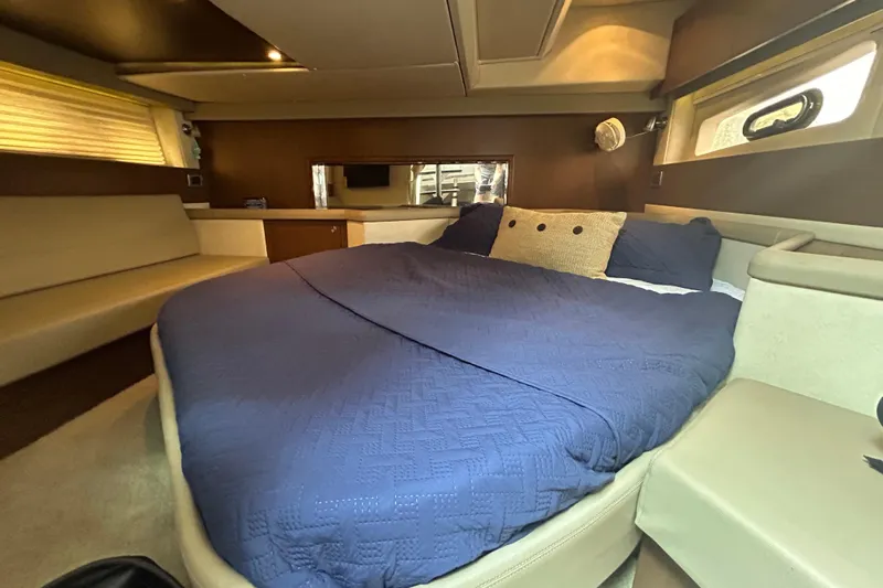 Mr Bojangles Yacht Photos Pics Luxurious cabin interior of 2014 Sea Ray 370 Venture with cozy bed and modern design.