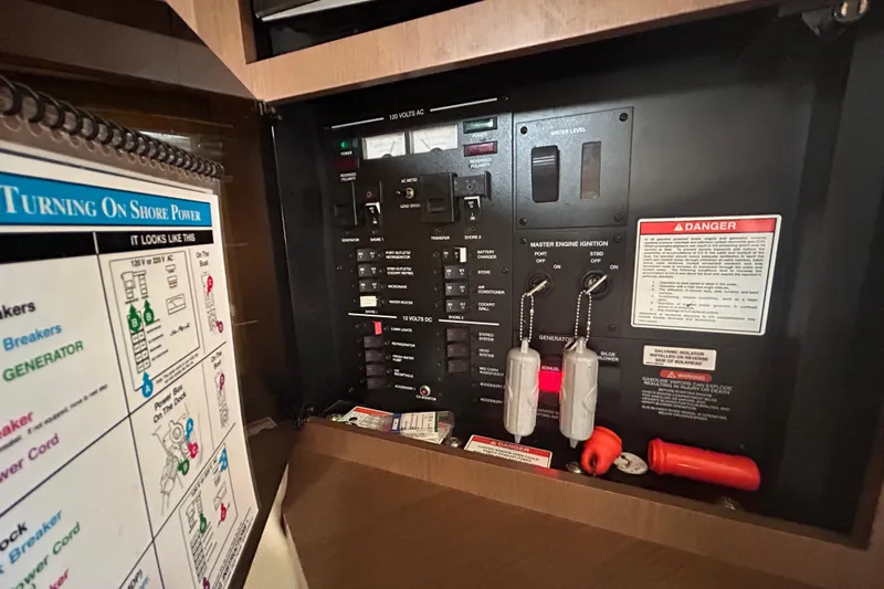 Mr Bojangles Yacht Photos Pics Electrical control panel of 2014 Sea Ray 370 Venture boat with safety instructions.