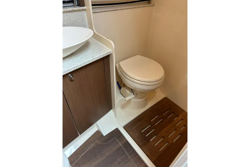 Mr Bojangles Yacht Photos Pics 2014 Sea Ray 370 Venture bathroom with modern sink and toilet.