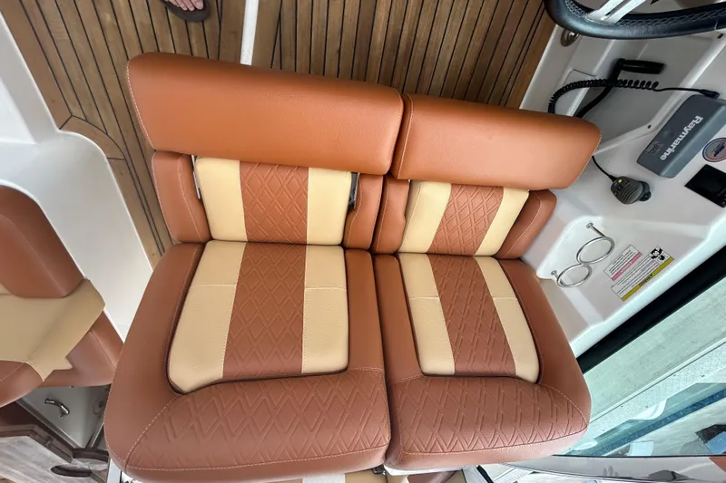 Mr Bojangles Yacht Photos Pics Brown and beige leather seats on 2014 Sea Ray 370 Venture boat.
