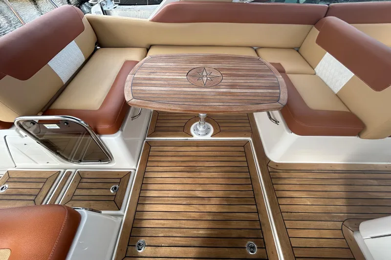 Mr Bojangles Yacht Photos Pics 2014 Sea Ray 370 Venture interior with teak flooring and cushioned seating.