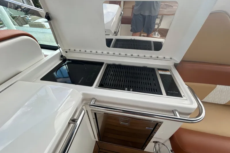 Mr Bojangles Yacht Photos Pics 2014 Sea Ray 370 Venture boat kitchen with Kenyon grill and induction cooktop.
