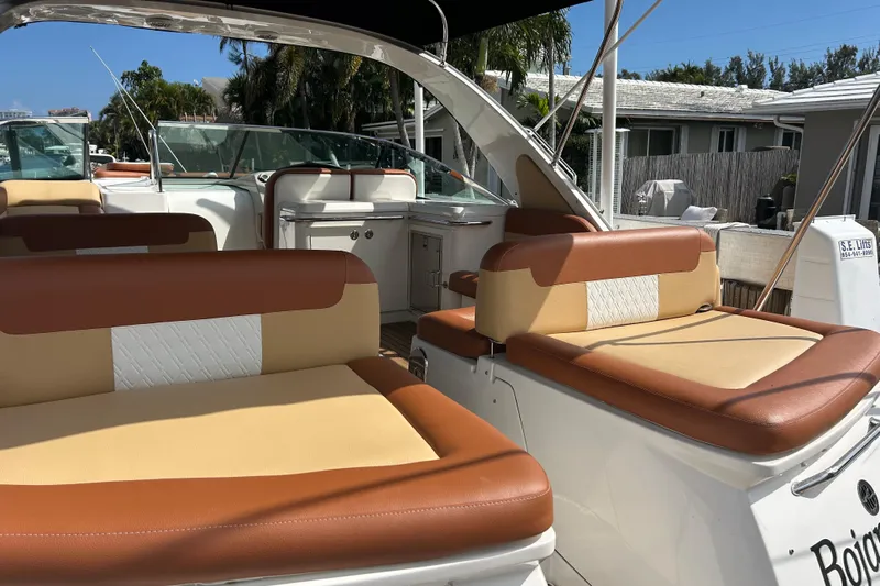 Mr Bojangles Yacht Photos Pics 2014 Sea Ray 370 Venture boat interior with tan and brown seating, docked outdoors.
