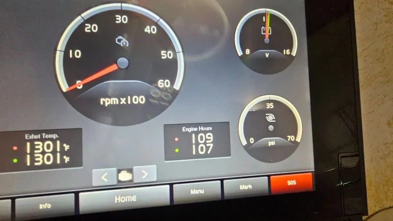  Yacht Photos Pics Dashboard display of a 2020 Regal 38 Grand Coupe showing RPM, engine hours, and temperature.