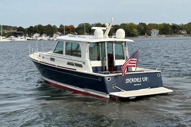  Yacht Photos Pics 2015 Sabre 42 Salon Express boat on water, rear view with American flag.