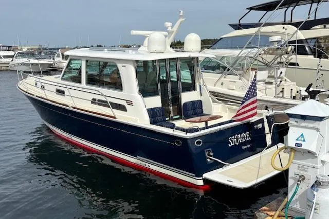  Yacht Photos Pics 2015 Sabre 42 Salon Express yacht docked with American flag displayed.
