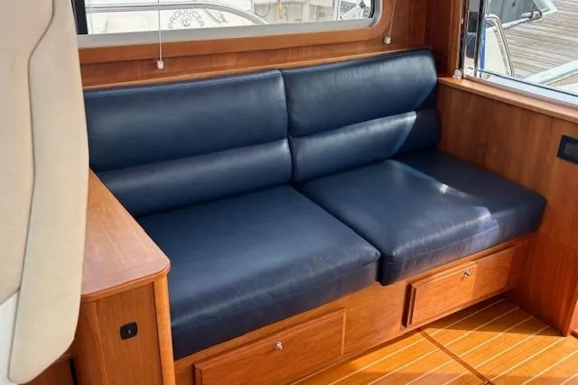  Yacht Photos Pics Luxurious interior of 2015 Sabre 42 Salon Express with navy leather seating.