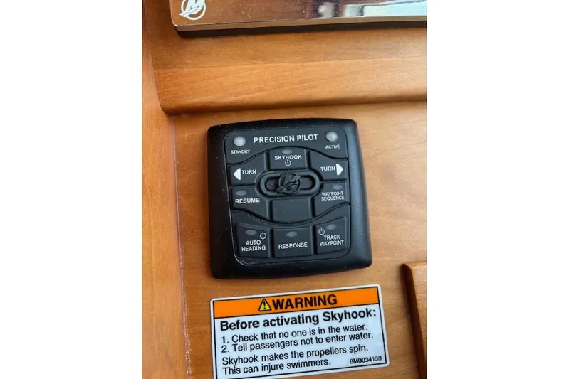  Yacht Photos Pics Control panel of 2015 Sabre 42 Salon Express with Skyhook feature and warning label.