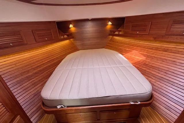  Yacht Photos Pics 2015 Sabre 42 Salon Express cabin with wooden interior and cozy bed.