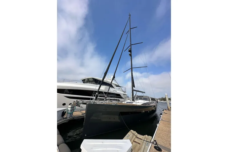 Imagine Yacht Photos Pics 2017 Jeanneau 64 yacht docked at marina under clear blue sky.
