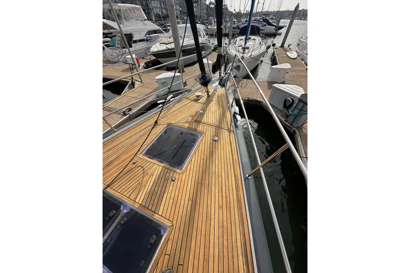 Imagine Yacht Photos Pics 2017 Jeanneau 64 yacht with teak deck, docked at marina.