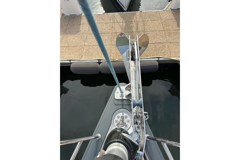 Imagine Yacht Photos Pics Bow view of 2017 Jeanneau 64 yacht with anchor and mooring line.
