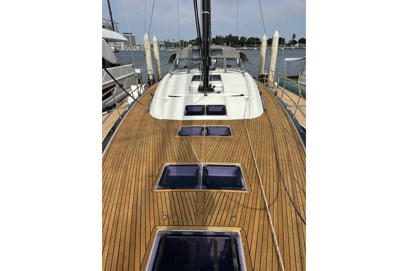 Imagine Yacht Photos Pics 2017 Jeanneau 64 yacht with sleek wooden deck and modern design.