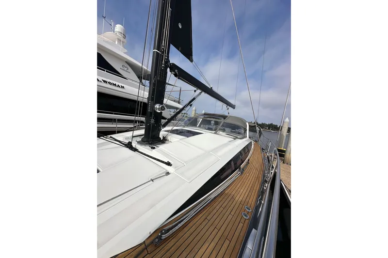 Imagine Yacht Photos Pics 2017 Jeanneau 64 yacht with sleek deck and modern design, docked at marina.