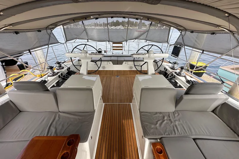 Imagine Yacht Photos Pics Luxurious 2017 Jeanneau 64 yacht cockpit with dual steering wheels and teak flooring.