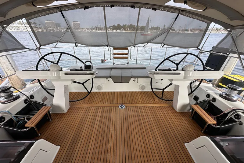 Imagine Yacht Photos Pics Luxurious 2017 Jeanneau 64 yacht cockpit with dual steering wheels and teak flooring.