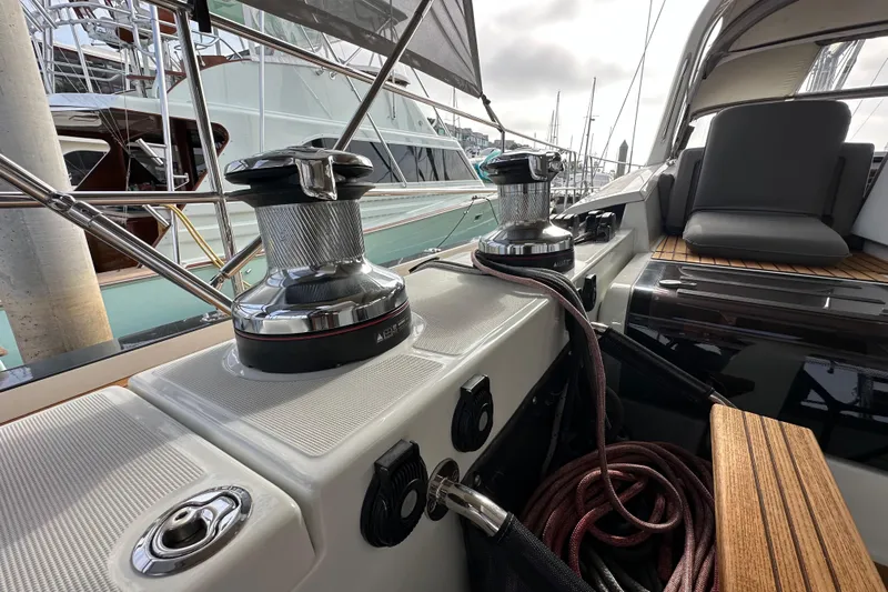 Imagine Yacht Photos Pics Jeanneau 64 yacht deck with winches and seating, 2017 model, docked at marina.