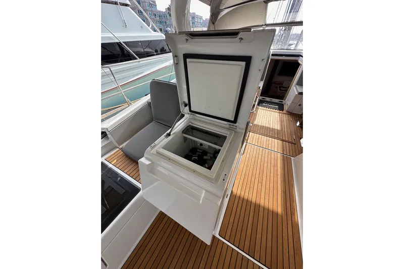 Imagine Yacht Photos Pics Open storage compartment on 2017 Jeanneau 64 yacht with teak deck.