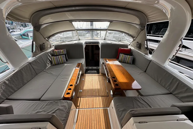 Imagine Yacht Photos Pics Luxurious 2017 Jeanneau 64 yacht interior with spacious seating and elegant wooden table.