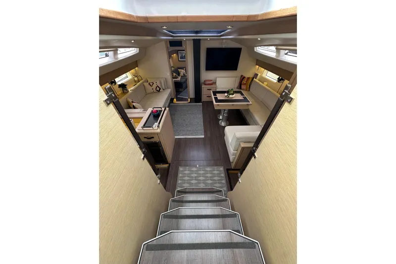 Imagine Yacht Photos Pics Luxurious interior of 2017 Jeanneau 64 yacht with modern seating and dining area.