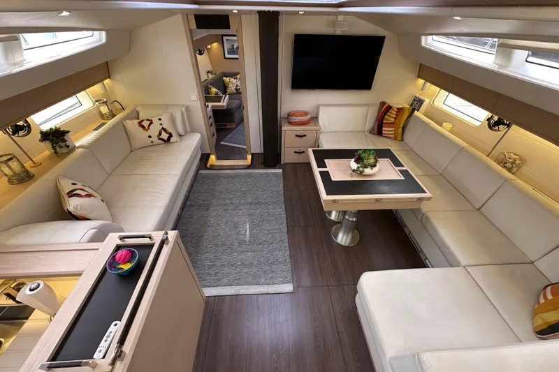 Imagine Yacht Photos Pics Luxurious interior of a 2017 Jeanneau 64 yacht with elegant seating and modern decor.