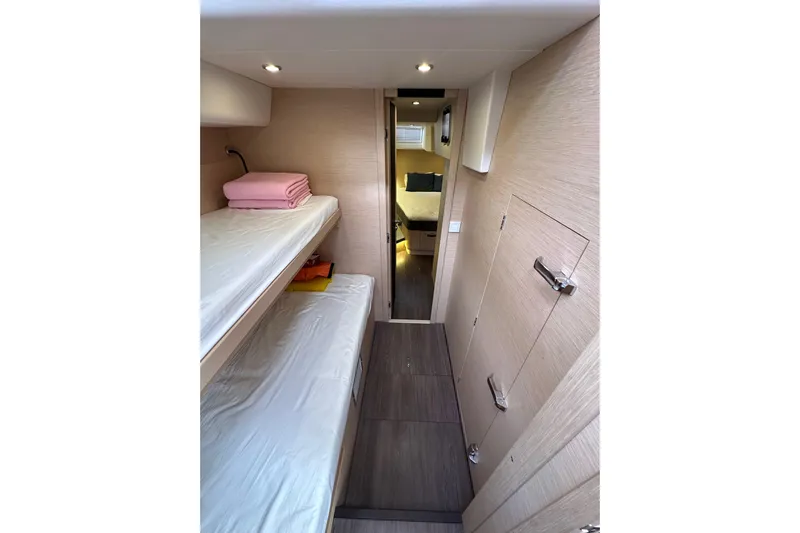Imagine Yacht Photos Pics Interior of 2017 Jeanneau 64 yacht with bunk beds and modern design.