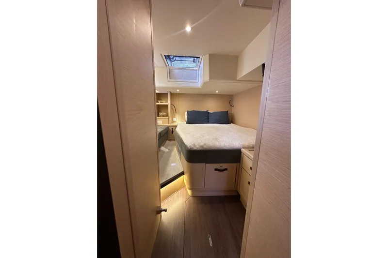 Imagine Yacht Photos Pics Luxurious cabin interior of 2017 Jeanneau 64 yacht with cozy bed and skylight.