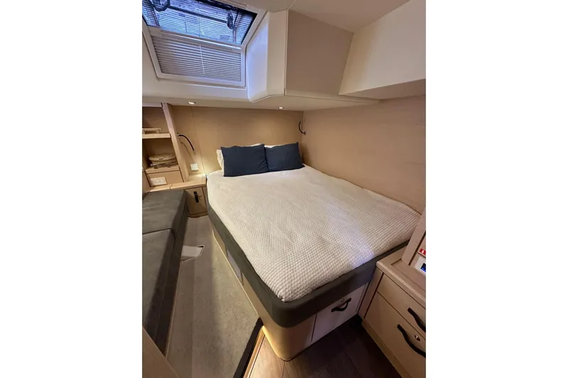 Imagine Yacht Photos Pics Luxurious cabin interior of 2017 Jeanneau 64 yacht with cozy bed and modern design.