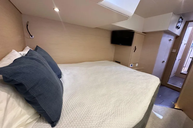 Imagine Yacht Photos Pics Luxurious cabin interior of 2017 Jeanneau 64 yacht with cozy bed and modern amenities.