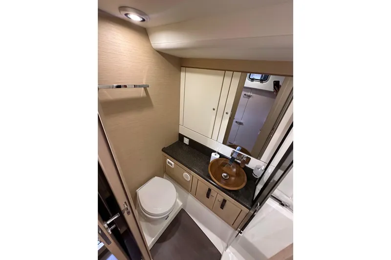 Imagine Yacht Photos Pics Luxurious bathroom in 2017 Jeanneau 64 yacht with modern fixtures and elegant design.