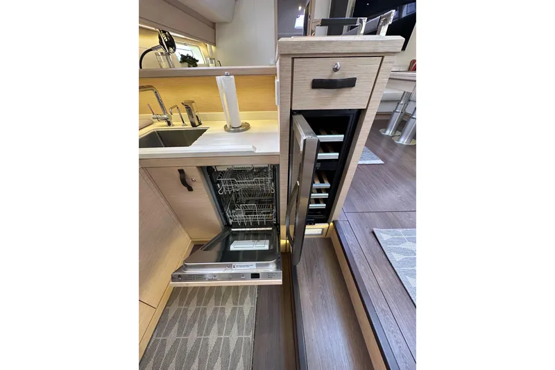 Imagine Yacht Photos Pics Modern kitchen in 2017 Jeanneau 64 yacht with dishwasher and wine cooler.