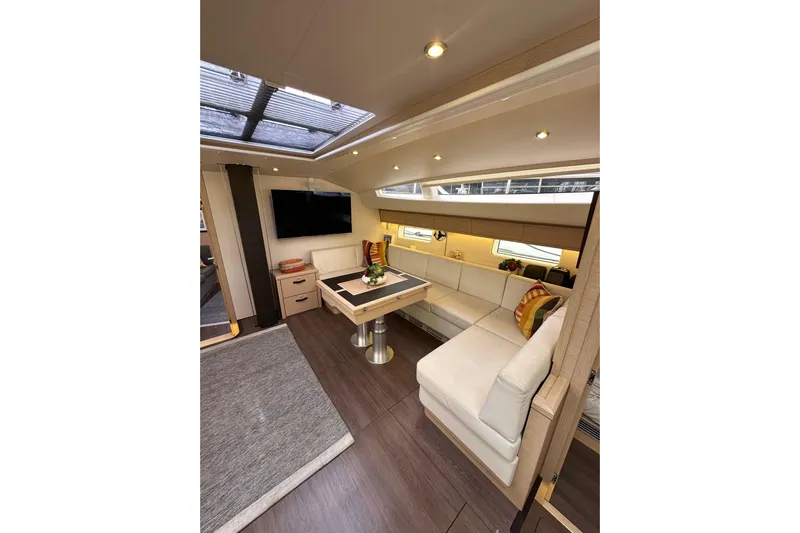 Imagine Yacht Photos Pics Luxurious interior of 2017 Jeanneau 64 yacht with elegant seating and modern decor.