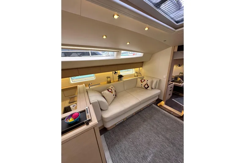 Imagine Yacht Photos Pics Luxurious interior of 2017 Jeanneau 64 yacht with elegant seating and modern design.