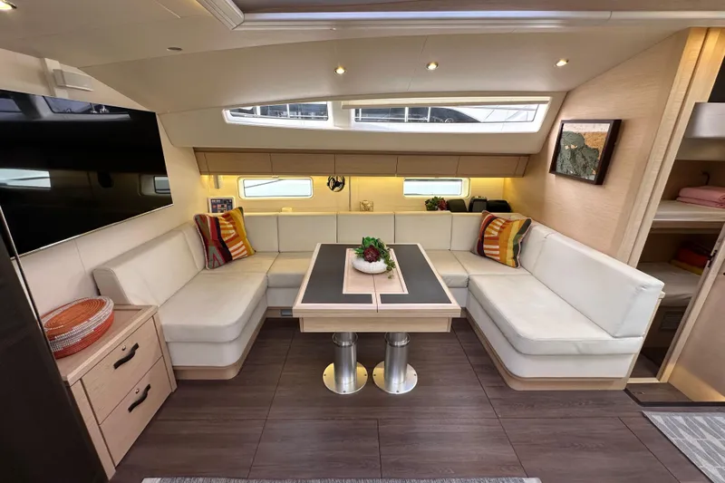 Imagine Yacht Photos Pics Luxurious interior of 2017 Jeanneau 64 yacht with elegant seating and modern decor.