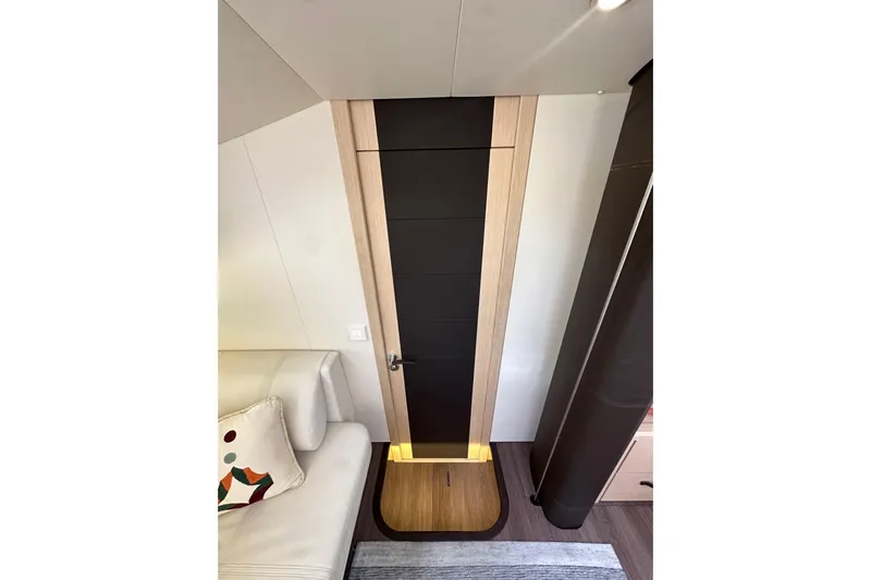 Imagine Yacht Photos Pics Interior of 2017 Jeanneau 64 yacht with modern door and stylish decor.