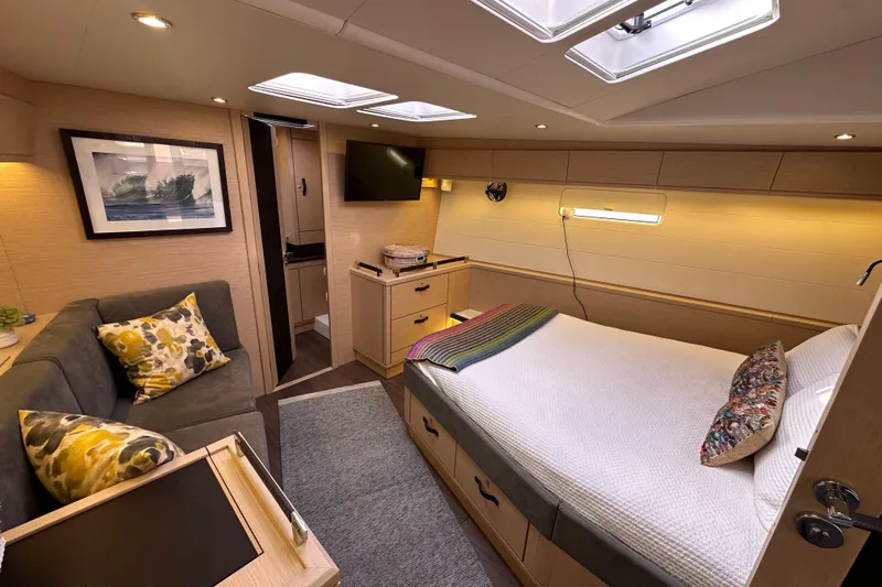 Imagine Yacht Photos Pics Luxurious 2017 Jeanneau 64 yacht cabin with cozy bed, sofa, and modern decor.